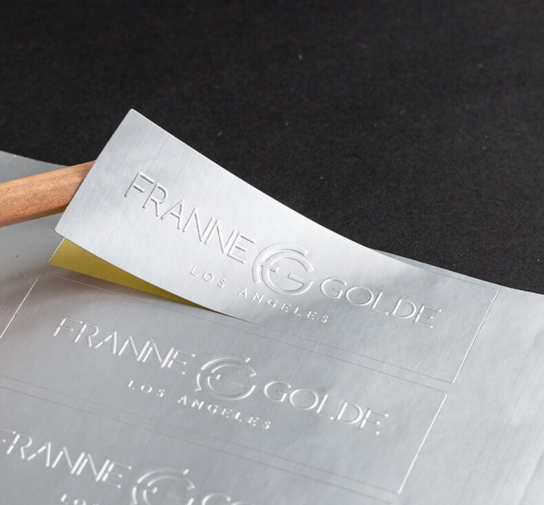 Luxe Metallic Silver Embossed Custom Labels | Sleek 3D Logo Stickers for Modern Branding